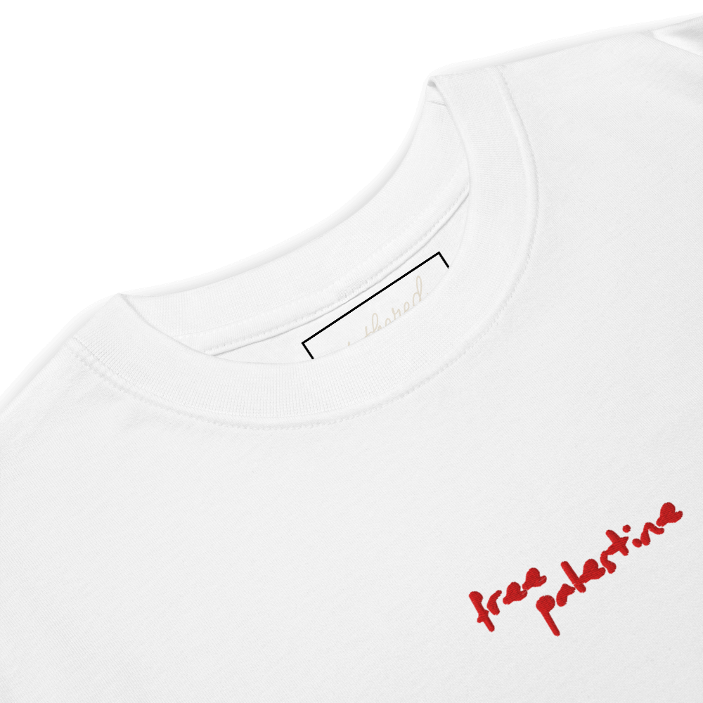 black free palestine tee hanging on wooden hanger