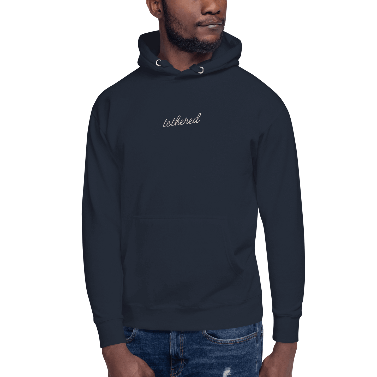 model wearing navy blue tethered hoodie outdoors