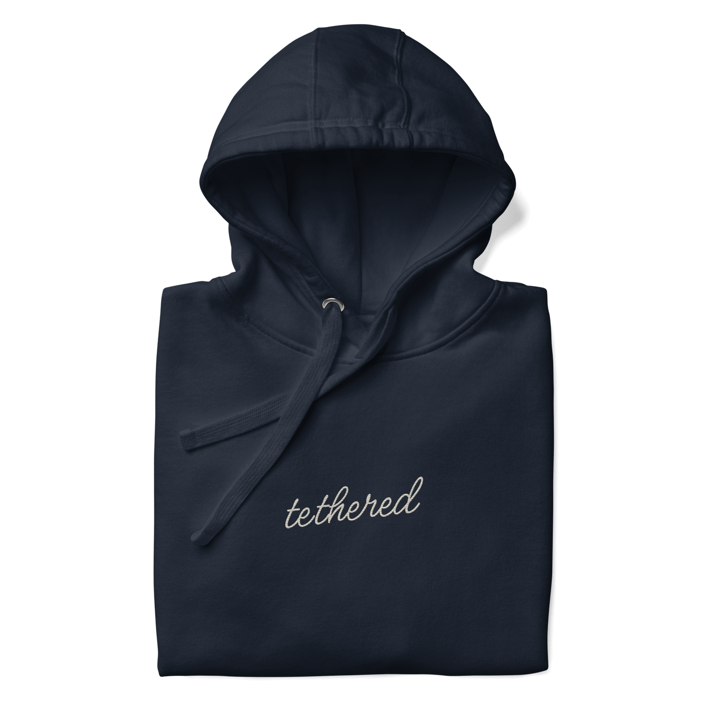 closeup of tethered logo embroidery on navy blue hoodie