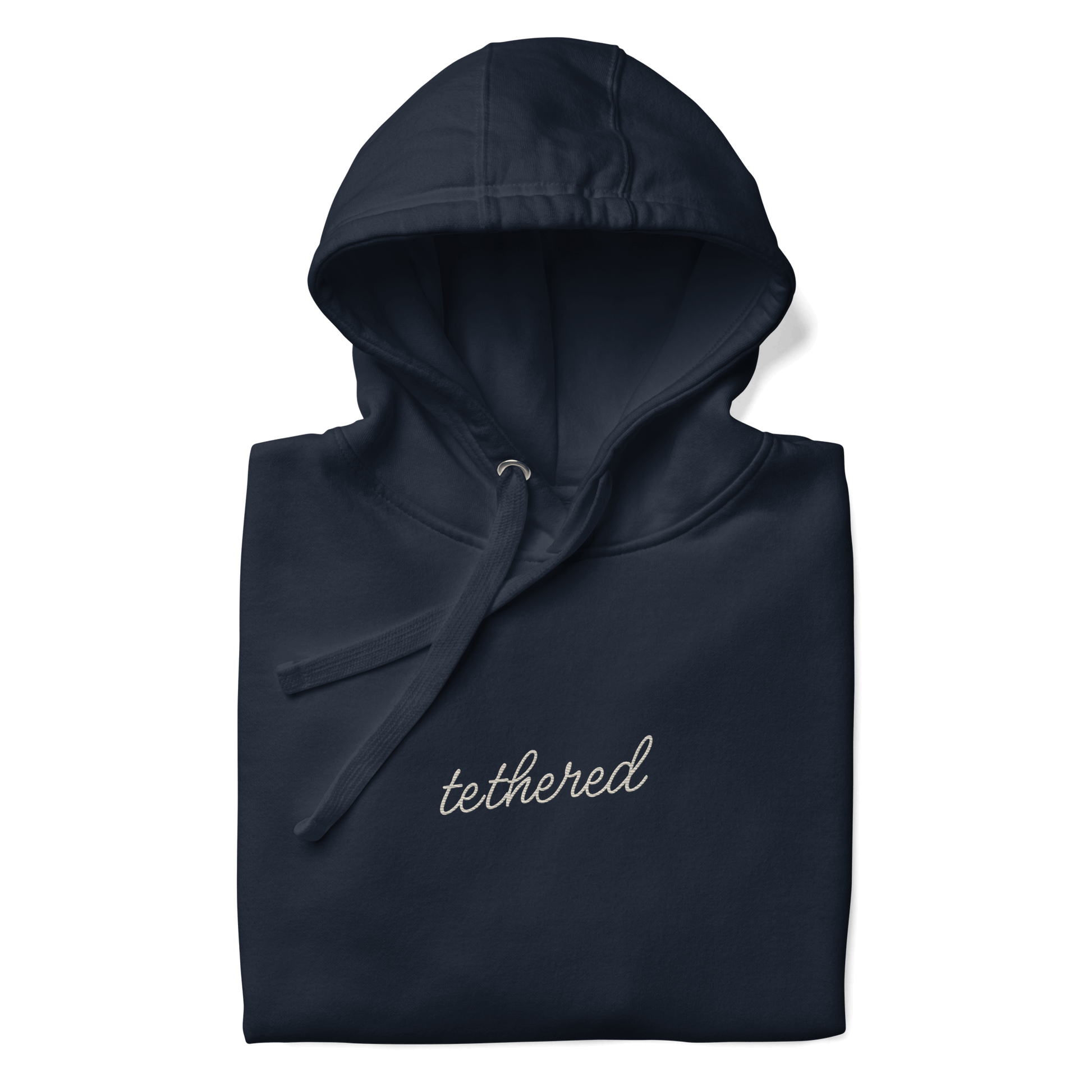 closeup of tethered logo embroidery on navy blue hoodie