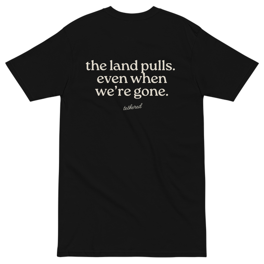 black the land pulls tee unfolded with strong heritage-inspired print